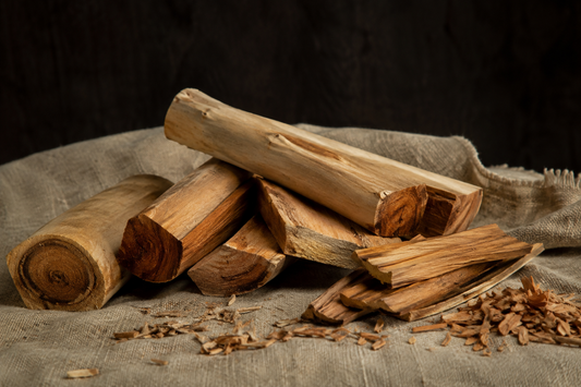 Rough-cut sandalwood billets showing pale sapwood around golden heartwood